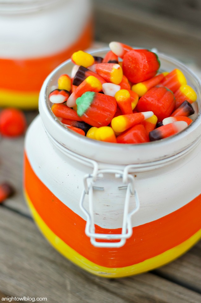 Paint Mason Jars in Candy Corn colors and fill them with treats for a festive fall gift idea! This is a fun kids craft too! 