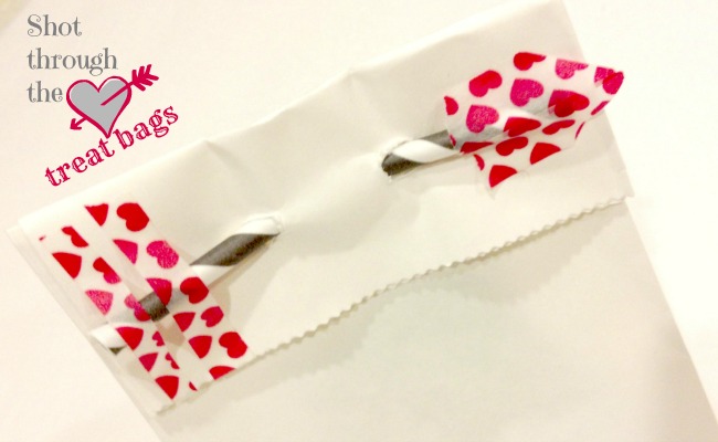 Craft a cute arrow with washi tape and a straw to make these adorable Shot Through the Heart Treat Bags { anightowlblog.com } #valentines #washi