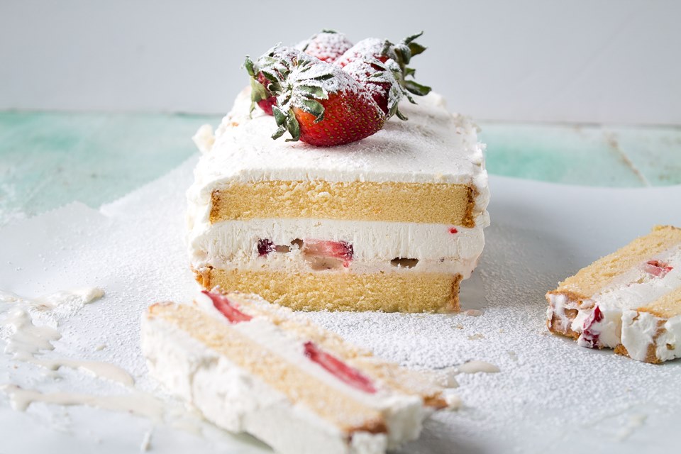 Layers of pound cake, strawberries, and ice cream make this a decadent and creamy Strawberries and Cream Ice Cream Cake!