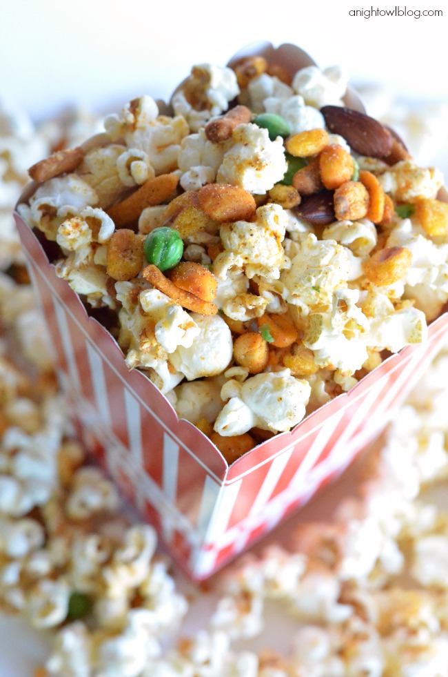 Gourmet Popcorn Recipes like this Spicy Cajun Popcorn are the perfect addition to movie night! Pick up all the supplies you need at World Market!