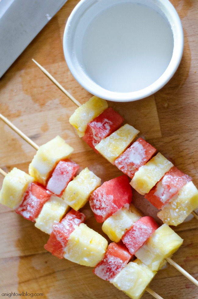 Pineapple and Watermelon Fruit Kabobs with a pina colada glaze, yum! 