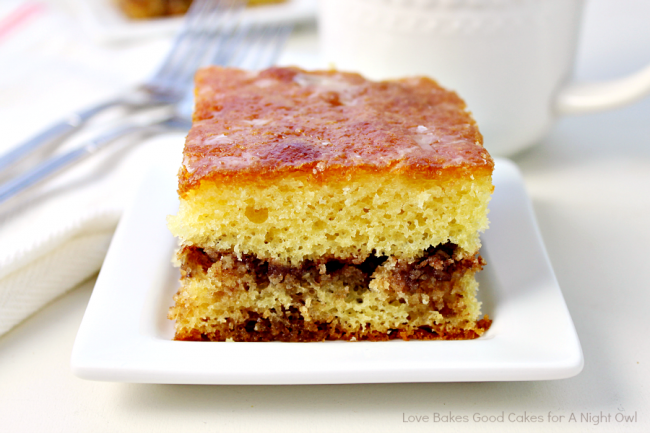 This Honey Bun Cake is reminiscent of the snack cake! A yellow cake mix is doctored up with a few ingredients, including a delicious cinnamon-nut layer!