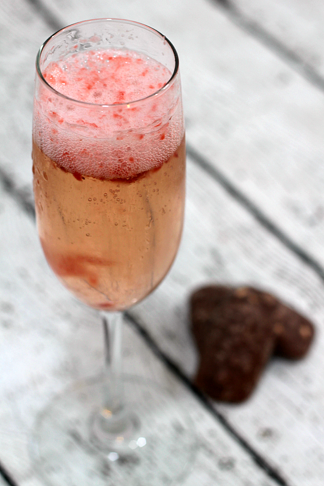 Light and refreshing champagne cocktail with a slight hint of strawberries. Perfect for Spring or Summer