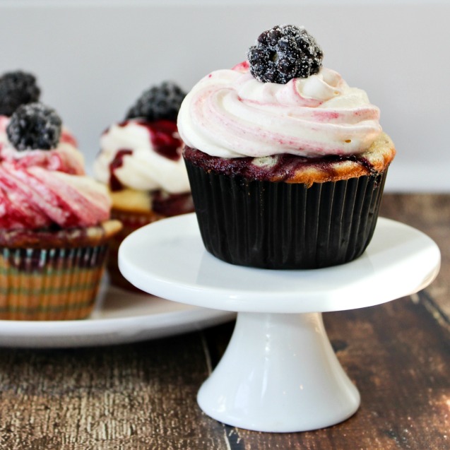 Vanilla bundt cake with blackberry swirls and vanilla glaze